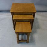 Robert 'Mouseman' Thompson, a nest of three oak tables, each with carved mouse to leg, H.50 W.46 D.