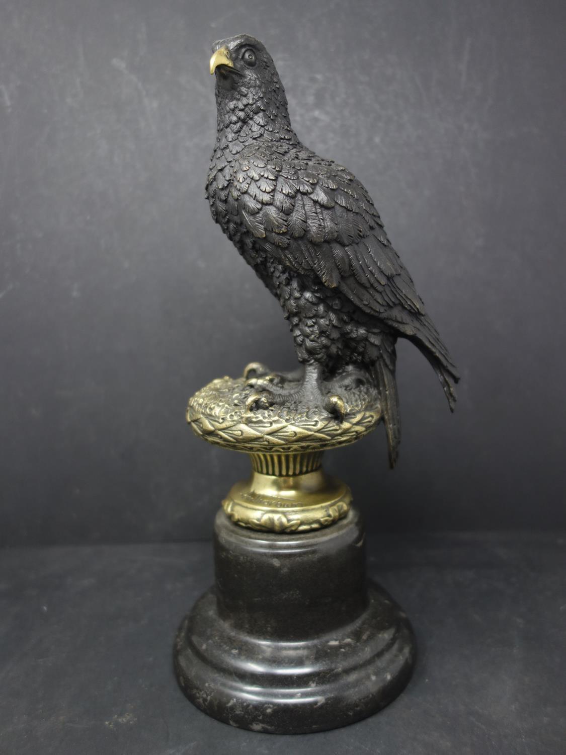 A bronze study of an eagle on a naturalistic base, after A. Thorbum, bearing signature, raised on