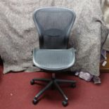 A Herman Miller swivel office chair, bearing label