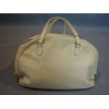 A Prada cream leather handbag