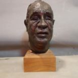A 20th century bronze bust of a gentleman, with label for the Royal Academy exhibition 1998, signed,
