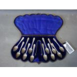 A Victorian set of 12 silver teaspoons and a pair of sugar tongs by Elkington & Co (Frederick