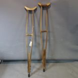 A pair of early 20th century pine adjustable crutches