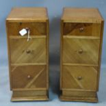 A pair of Art Deco oak and walnut pedestal chests of three drawers, on pedestal bases, H.72 W.32 D.