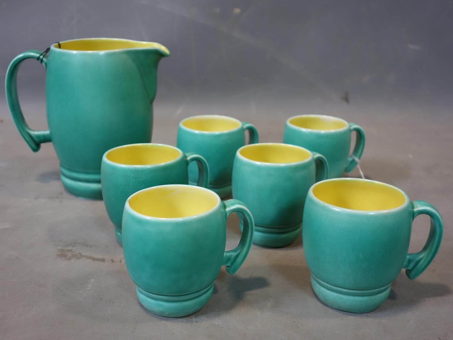 A set of 6 Bretby cups and the matching jug