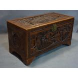 An early 20th century Chinese camphor wood trunk, profuseley carved, H.55 W.101 D.50cm