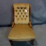 A Victorian mahogany nursing chair, with button back velour upholstery