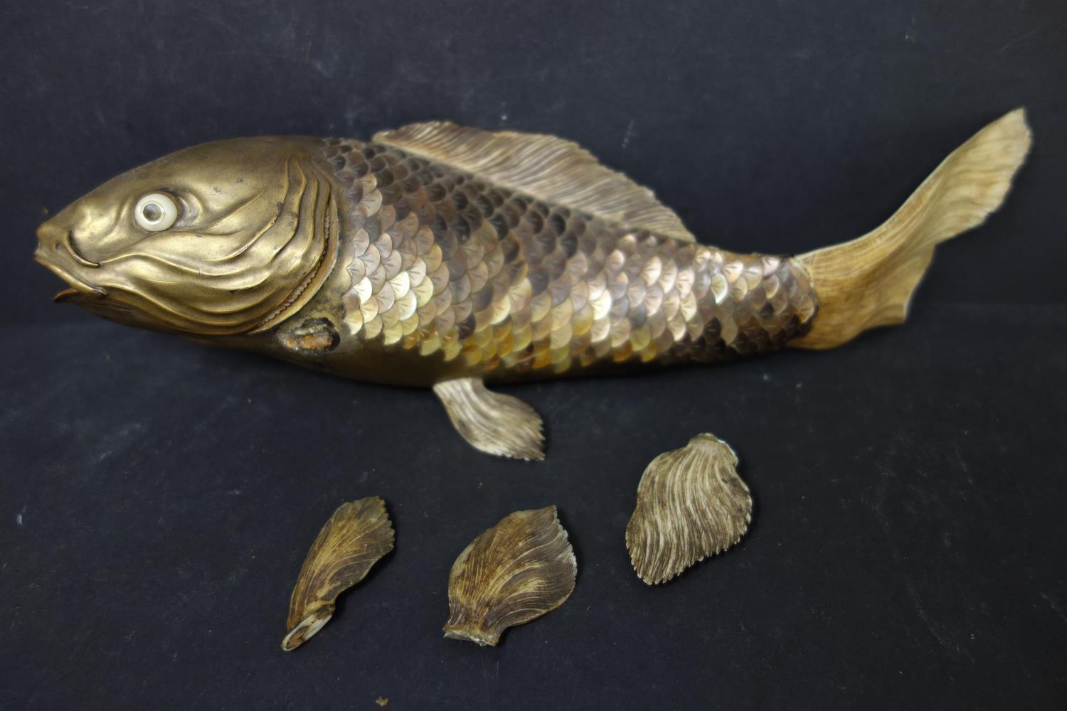 A 19th century Japanese bone, bronze and tiger's eye fish, signed, with pieces broken off and some