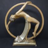 An Art Deco plaster figure of dancing girl, bearing impressed marks OP. 410, RD. 826323 to base, H.
