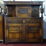 An early 20th century Jacobean style oak court cupboard, H.134 W.122 D.48cm