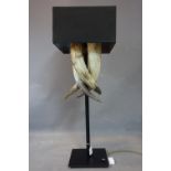 A designer Italian buffalo horns table lamp, on iron stand, H.94.5cm