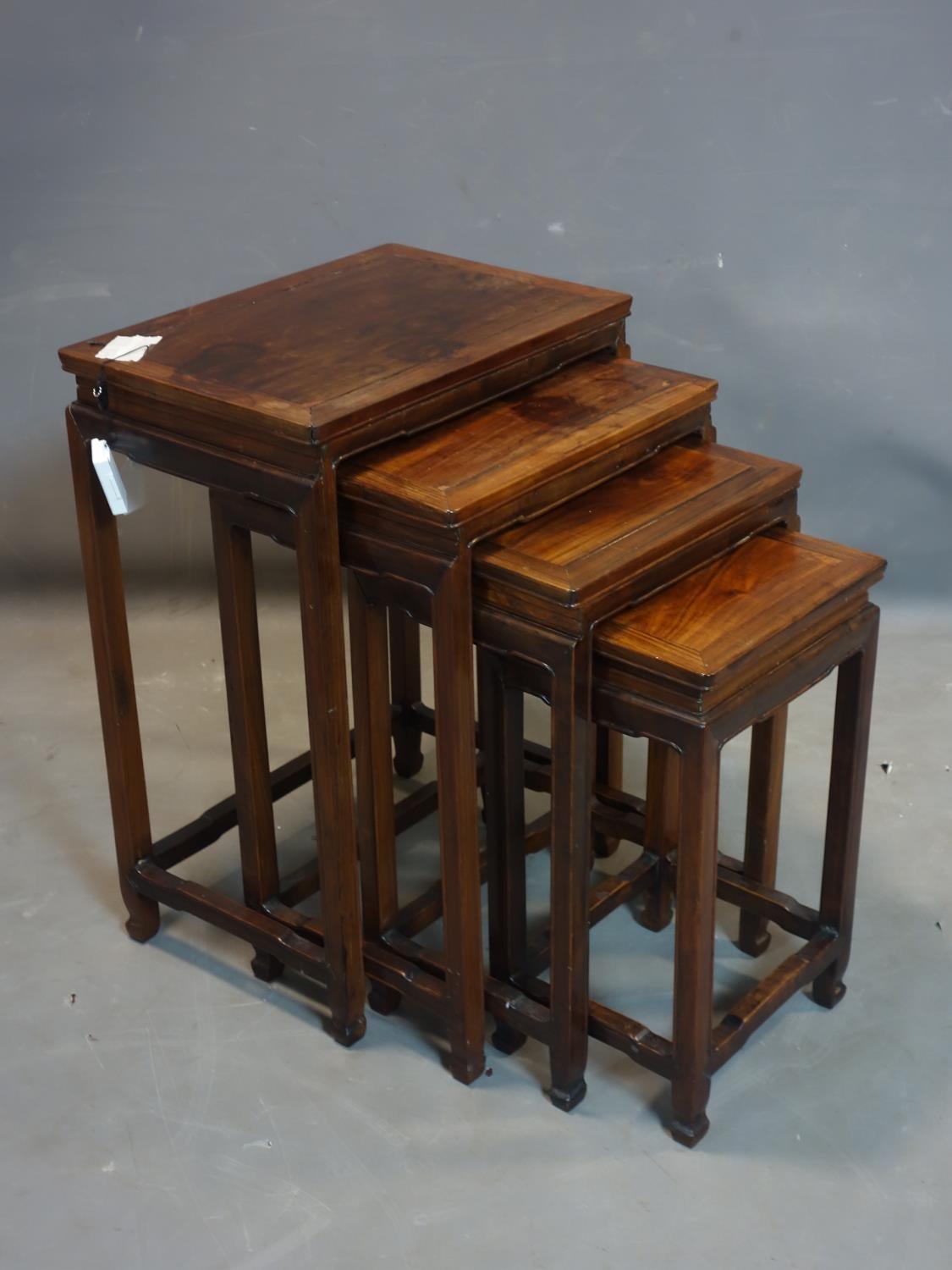 A 20th century Chinese hardwood nest of 4 tables, H.65 W.47 D.33cm