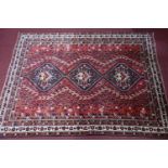 A Southwest Persian Qashqai carpet, triple pole medallion with repeating petal motifs on a