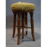 A Victorian walnut adjustable piano stool