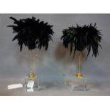 A pair of feathered ornaments on perspex bases, H.42cm