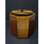 An Art Deco satinwood, walnut, ebony and burr walnut octagonal tea caddy, H.16.5 W.16.3 D.16.3cm,