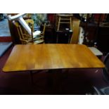 A mid 20th century teak drop leaf table, H.72 W.150 D.83cm