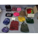 A large collection of designer handbags, mainly leather