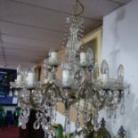A 20th century 15 branch chandelier, with floral sconces and glass droplets, H.66 Diameter 58cm