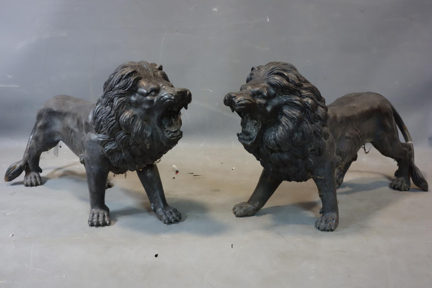 A large pair of cast spelter models of lions, H.49 W.83 D.24cm