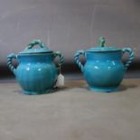 A pair of Persian cyan glazed pots and covers, with rope twist design handles, H.26 W.28cm