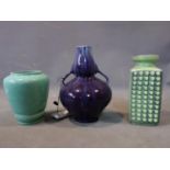 A Poole 'shagreen' pottery vase together with a West German pottery vase and a purple glazed vase
