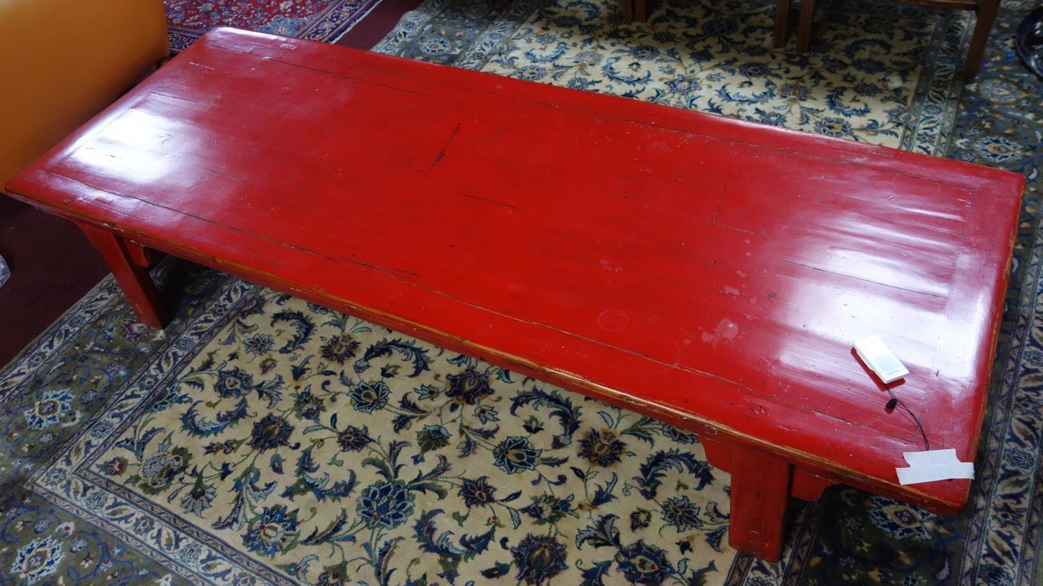 A large 20th century Chinese red lacquered coffee table, H.40 W.213 D.79cm - Image 2 of 3