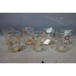 A set of 7 art glass tumblers each indistinctly signed to base