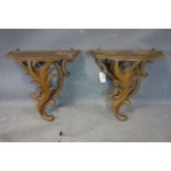 A pair of oak wall brackets, carved with scrolling foliage, H.50 W.45 D.28cm