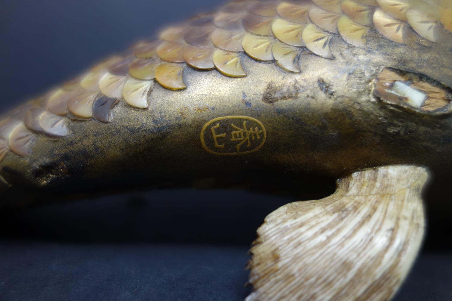 A 19th century Japanese bone, bronze and tiger's eye fish, signed, with pieces broken off and some - Image 3 of 3