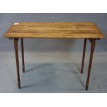 A vintage pine draftsman table raised on folding legs, H.66 W.93 D.49cm