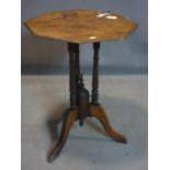 A walnut tilt top table, on turned supports and outswept legs, H.71 W.51 D.53cm