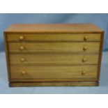 A teak chest of four graduating drawers, on pedestal base, H.56 W.89 D.44cm