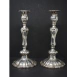 A pair of 19th century silver plated candlesticks, with knopped stem on spreading base, H.30cm