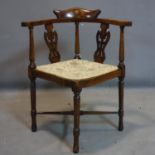 A Victorian mahogany corner chair