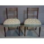 Two 19th century mahogany chairs, with floral upholstered seats, raised on turned legs (2), break to