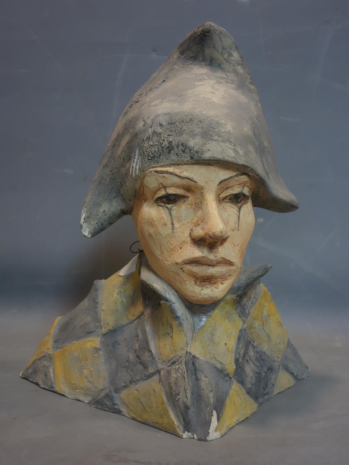 A pottery bust of a Harlequin, signed Pastok and signed '98 to reverse, H.44 W.38 D.26cm