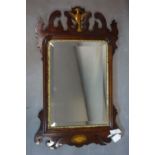 A 1Georgian mahogany fretwork mirror, with rectangular bevelled glass plate, having bird finial