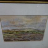 A watercolour of a landscape scene, monogrammed V.W. to lower right, framed and glazed, 24 x 35cm