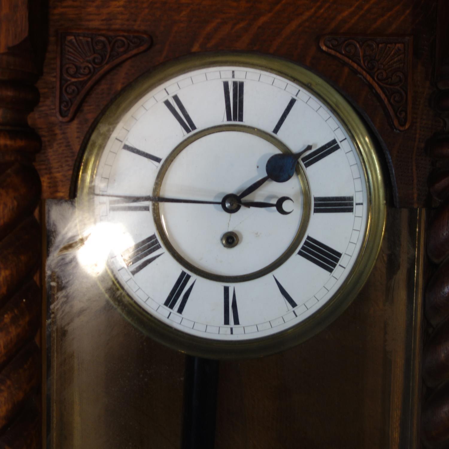 A 19th century Vienna regulator, white enamel dial with Roman numerals, with glazed door having twin - Image 2 of 2