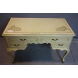 A cream painted French style writing desk fitted plate glass top. H.78 W.115 D.60cm