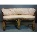 A vintage bamboo and wicker conservatory sofa