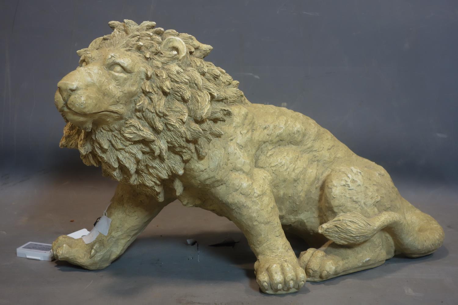 A resin figure of a lion, H.38 W.62 D.32cm