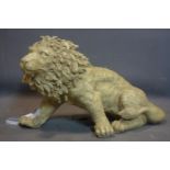 A resin figure of a lion, H.38 W.62 D.32cm