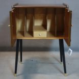 A 1950's brass bound walnut record cabinet, raised on tapered legs, H.84 W.60 D.38cm
