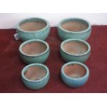 Two sets of three teal glazed planters of graduating size, H.23cm Diameter 42cm (largest)