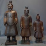 A large set of three 20th century reconstituted stone statues of Chinese warriors, tallest H.124cm