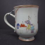 WITHDRAWN- An large chinese export tankard mug, enamelled in polychrome with figures flanking