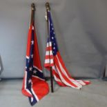 An American flag, together with a US Confederate flag, both on brass clad poles