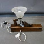 A table lamp made from woodworking plane, with frosted glass shade, H.31 W.43cm